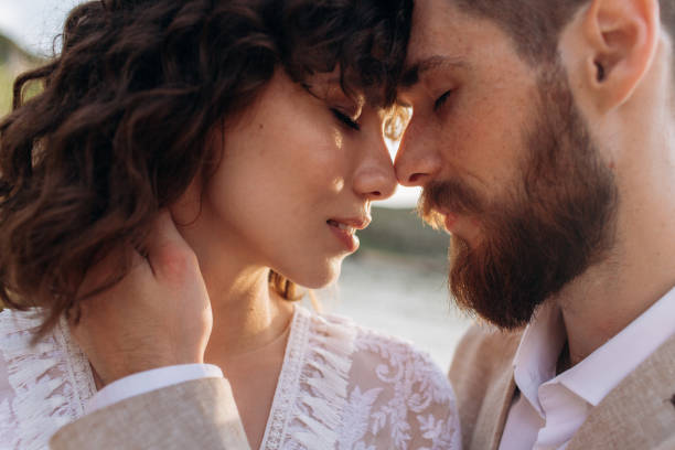 istock Wedding on the sunset with live floristry. Bride and groom in boho style. 1389017045