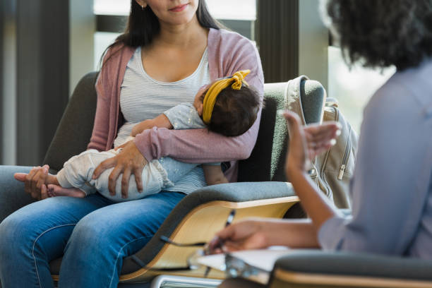 istock Two unrecognizable humans having a conversation while the baby sleeps 1389017560