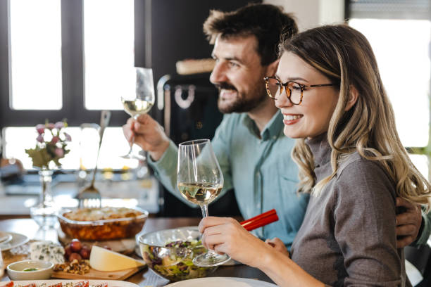 istock Beautiful couple toasting with wine 1389017750