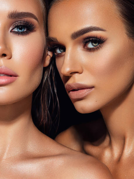 istock Two beautiful emotional women with perfect make-up 1389017845