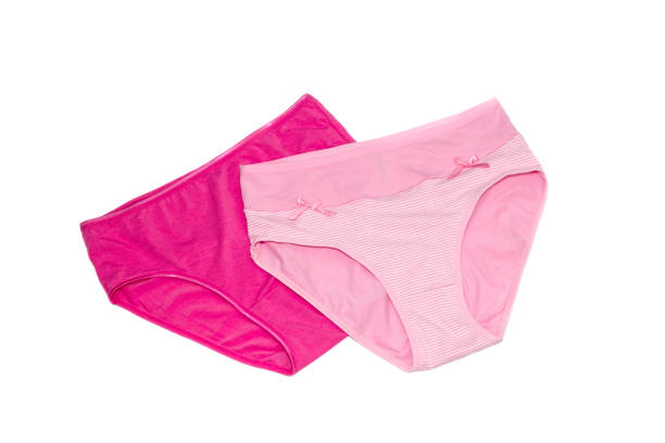 istock Female pink panties on a white background 1389017936