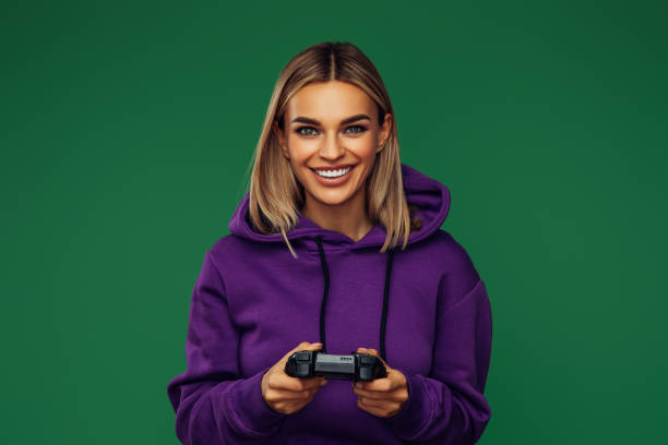 istock Woman holding joystick and playing 1389018764