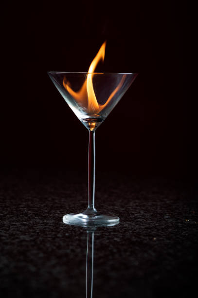 istock A Single Martini glass on a reflective surface with a black background 1389021869