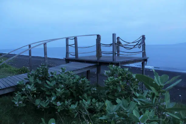 Photo of Wooden bridge on the the beach at blue hour.