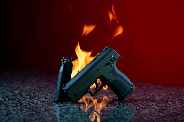 istock Flaming pistol, A Camo green pepper marker pistol 1389030561