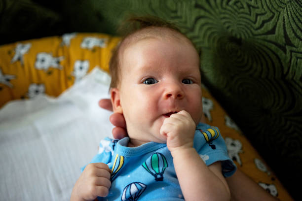 istock Older sister holding a newborn baby 1389031351