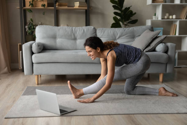 istock Smiling Hispanic woman training online using laptop 1389032732