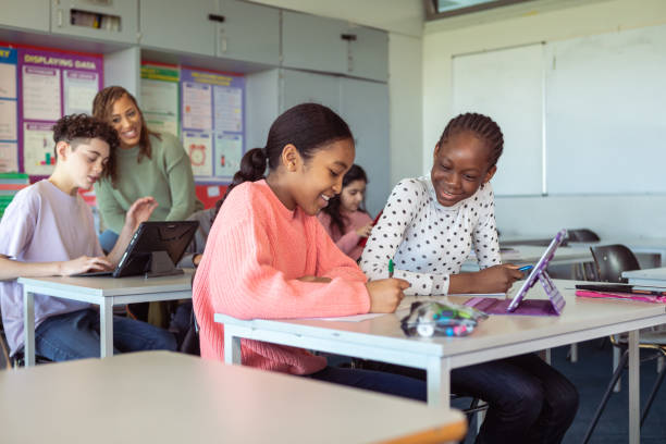 istock Happy friends in classroom 1389037798