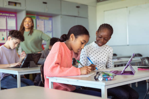 istock Happy friends in classroom 1389037800