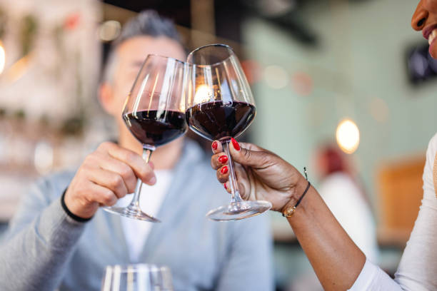 istock Diverse Coworkers Celebrating With Wine At Cafe 1389042963