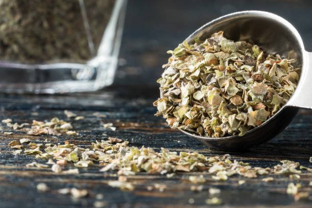 Dried Marjoram Herb on a Spoon stock photo