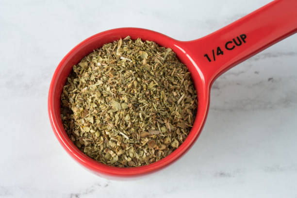 istock Dried Oregano Herb in a Measuring Cup 1389048293