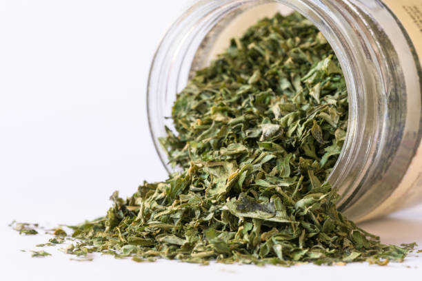 istock Dried Parsley Spilled from a Spice Jar 1389048353