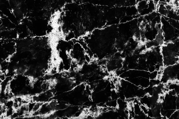 istock Dark black marble with white lightning seamless patterns on floor background 1389051577