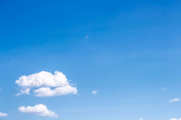 istock Clouds on bright blue sky with light wind with summer vast space background 1389053618