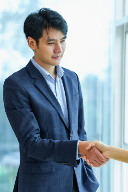 istock Business people successful negotiation and handshake. celebration partnership and teamwork, business deal concept 1389057251