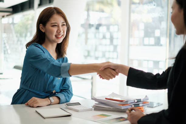 istock Business people successful negotiation and handshake. celebration partnership and teamwork, business deal concept. 1389057342
