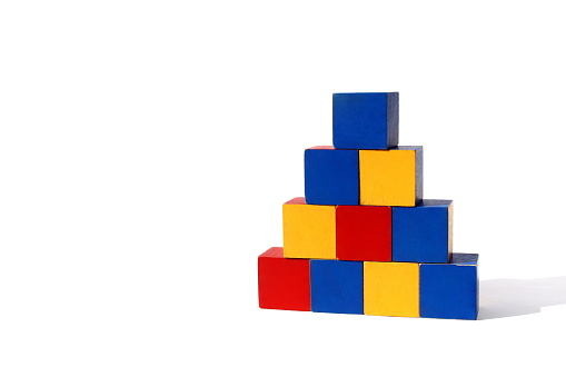 Pyramid of children's cubes of bright multi-colored colors.