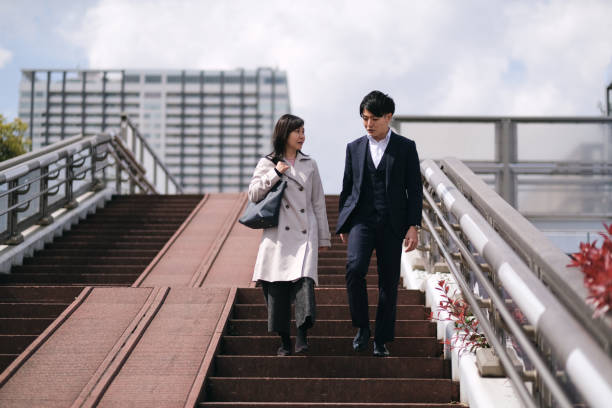 Coworkers walking down on the staircase
