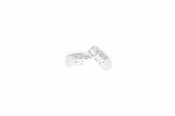 istock Car dimmer lights bulbs LED type in white background for texture and copy space 1389064973