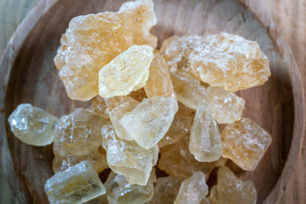istock big brown sugar cane crystal on wooden table 1389065241