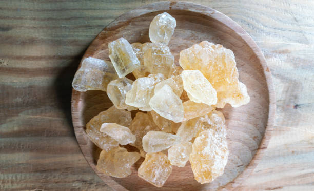 istock big brown sugar cane crystal on wooden table 1389065246