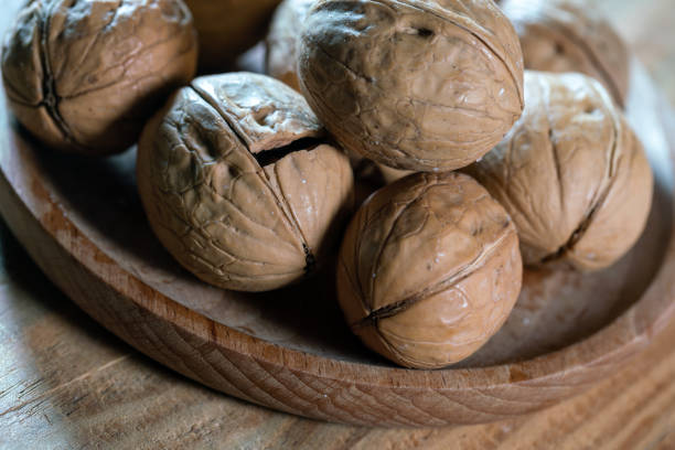 istock Walnuts roasted with salt on wooden table 1389067567