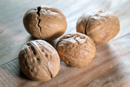 Walnuts roasted with salt on wooden table