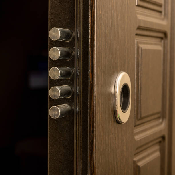 Metal door lock ajar with round bolts with a keyhole