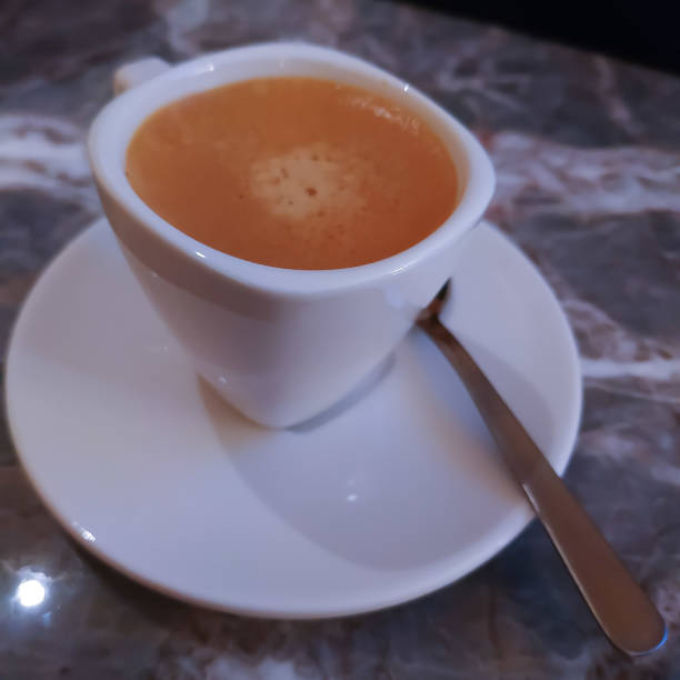 istock Espresso coffee in a white little cup 1389072390
