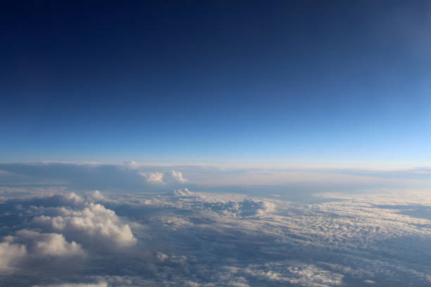 istock View of the sky and clouds from the airplane window. 1389075543