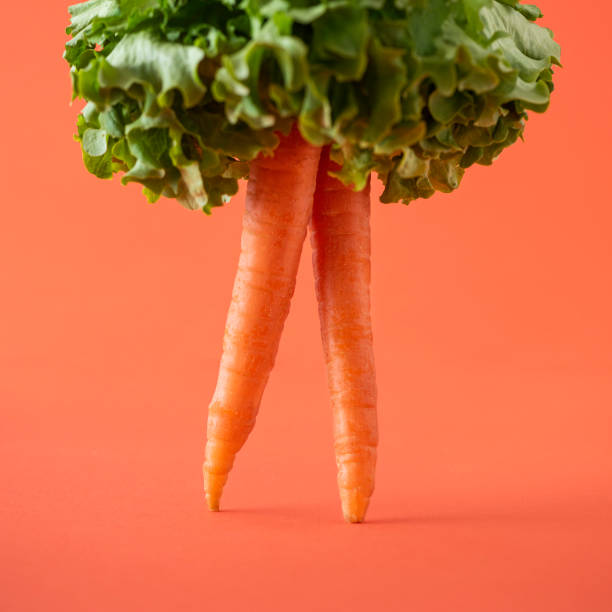 Creative photos of carrots on an orange background