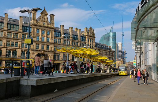 22nd March 2022: Corn Exchange Metrolink tram station, in Corn Exchange Square in the City of Manchester. One of the iconic yellow trams is coming into the station. The area is a busy district with retail outlets with the nearby Arndale Centre, restaurants and offices, making it a popular destination for residents, visitors and people working in the city. The surrounding area is undergoing major redevelopment with lots of new buildings going up.