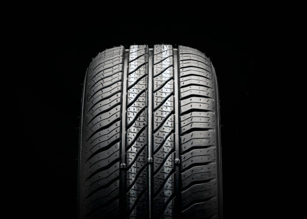 istock new economical eco-friendly summer tire on a black background, copyspace advertising space. 1389087471