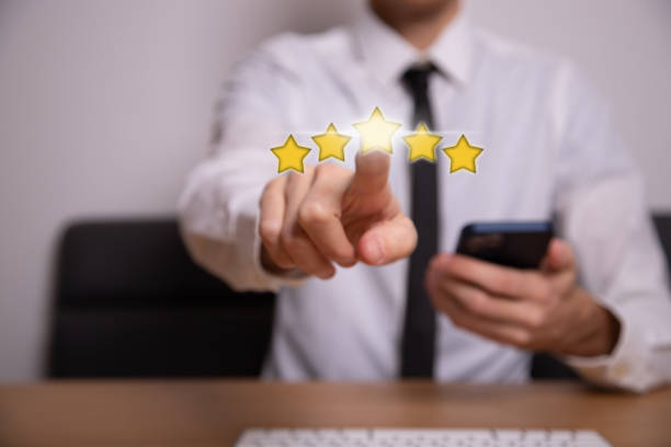 istock Businessman pressing smiley face emoticon on virtual touch screen 1389087612