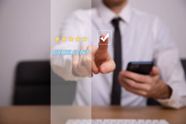 istock Businessman pressing smiley face emoticon on virtual touch screen 1389088208