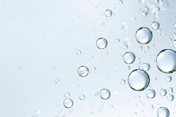 istock champagne bubbles or cosmetic liquid water bubbles floats drops surface over a blurred background 1389089511