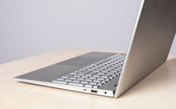 istock Open laptop at desk. Using computer for online education and work, social communication, leisure, shopping and booking. 1389094888