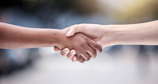 istock Shot of two protestors shaking hands during a rally 1389095009