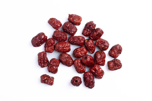 istock Dried Chinese jujube piled on a white background. Isolated image. 1389097614