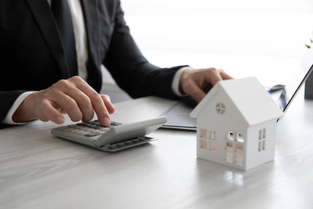 istock Real Estate Agent is Working in His Office 1389098225