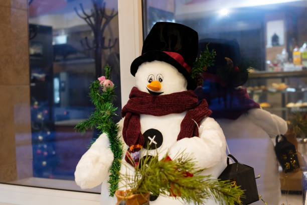 istock Decorative snowman on the windowsill, Christmas decoration 1389099279