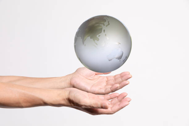 Planet in heart shape hands on white background
