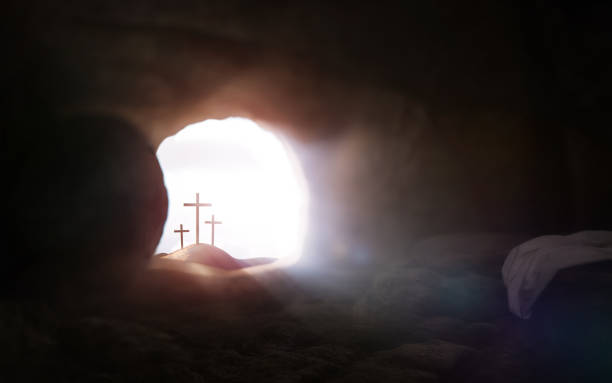 empty tomb and cross symbolizing the resurrection of jesus christ and easter - tomb imagens e fotografias de stock