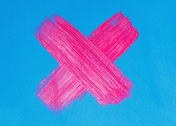 istock neon pink paint brush stroke cross isolated on blue background 1389104221