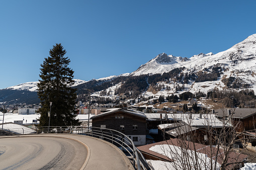 Davos, Switzerland, March 23, 2022 View over the snow covered winter landscape and the majestic alps on a sunny day