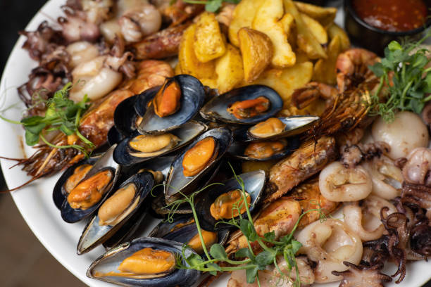 istock person is going to eat seafood. 1389105721