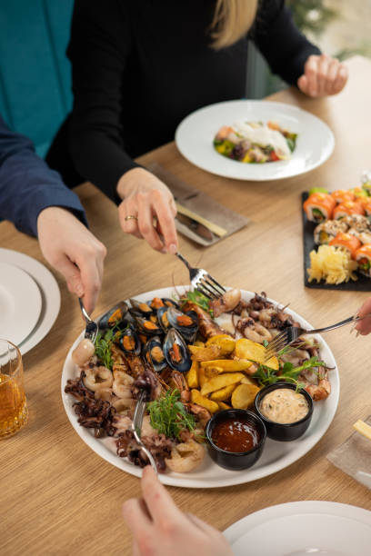 istock person is going to eat seafood. 1389105799