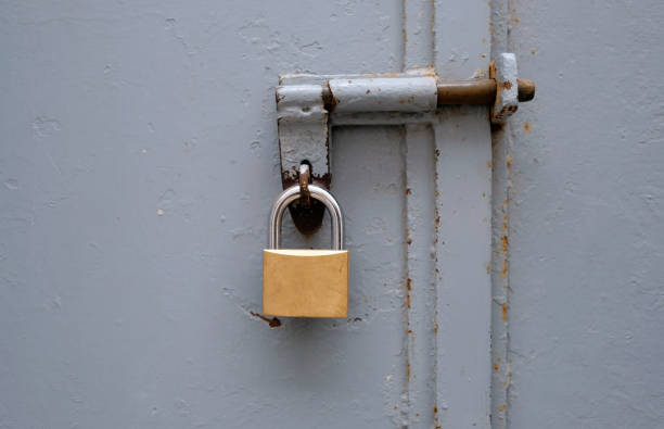 istock Metal padlock on a metal gate 1389108087