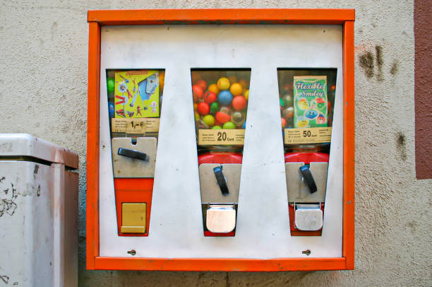 german gumball machine Neckargemuend, Germany: April 3, 2005: Vintage outdoor chewing gum vending machine which can still often be found in germany today gumball machine stock pictures, royalty-free photos & images